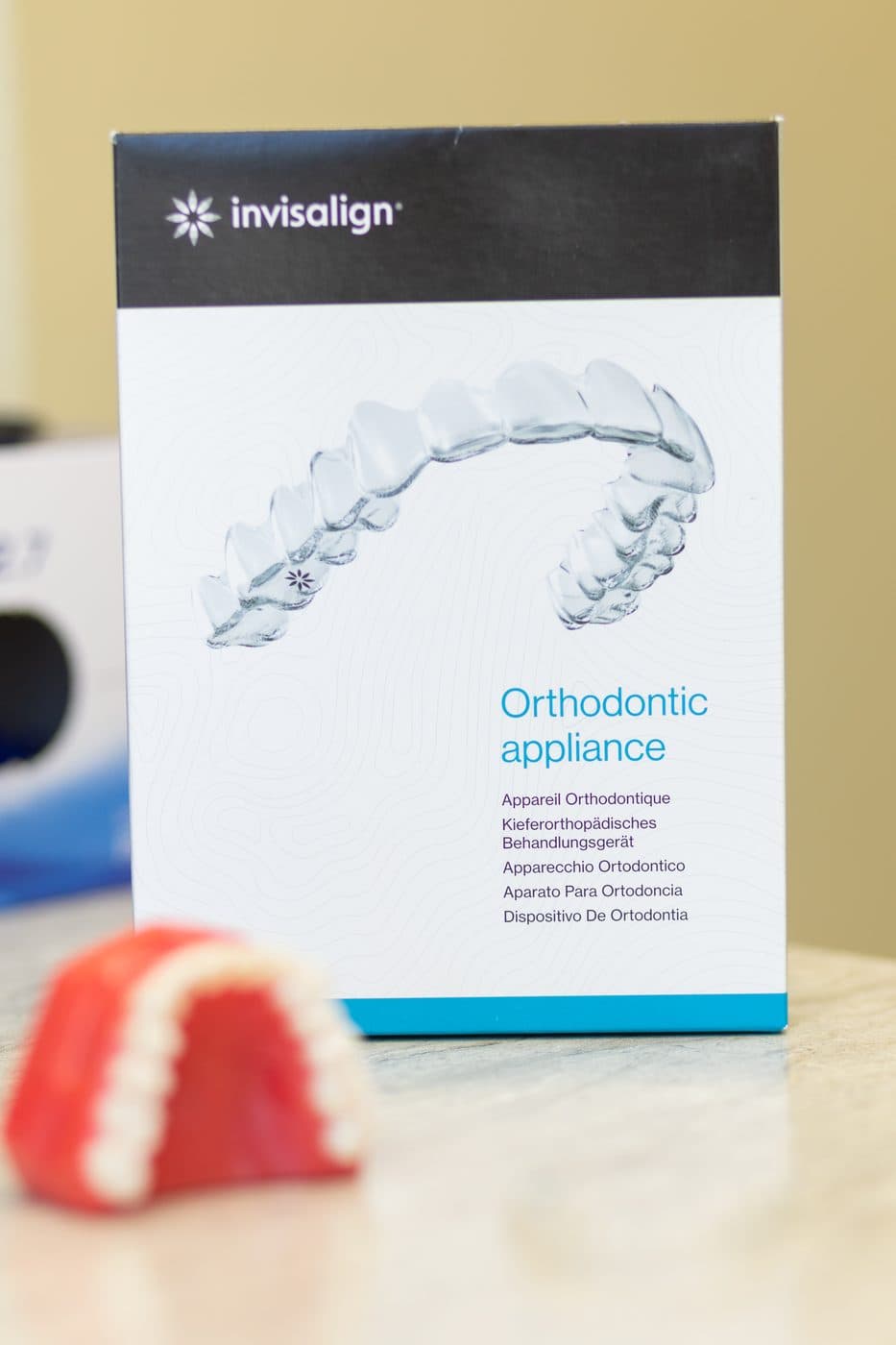 An Invisalign box and a model of teeth on a counter in the Mesquite office