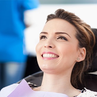 Female patient smiling in dental chair