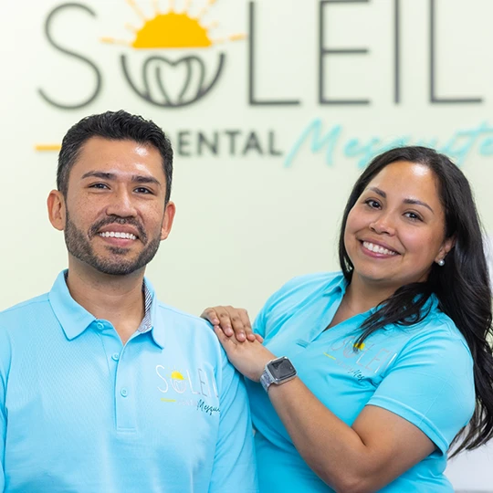 Mesquite dentists Doctor Vazquez and Doctor Aldana standing and smiling with arms crossed