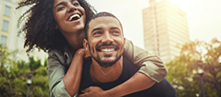 Man and woman hugging and laughing together